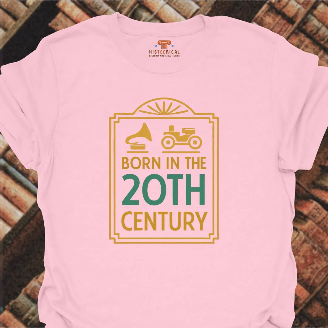 Pink t-shirt with 'Born in the 20th Century' design on a brick background