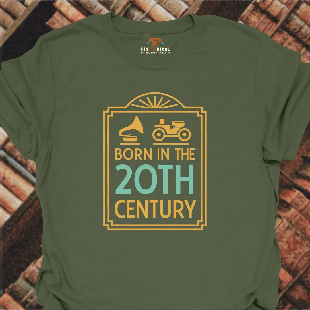 Green t-shirt with 'Born in the 20th Century' design on a brick background
