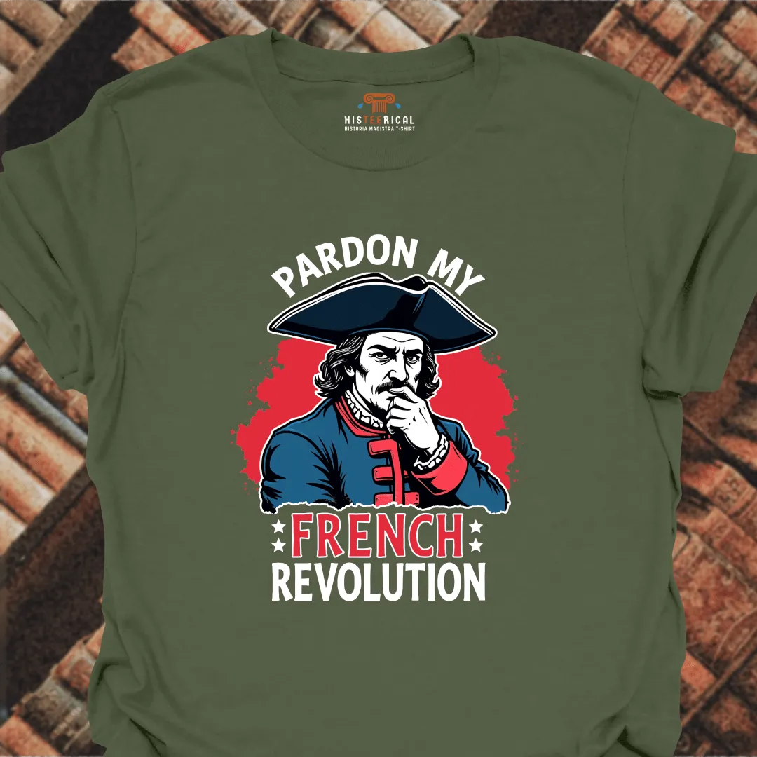 Green t-shirt with a graphic of a historical figure and text 'Pardon My French Revolution' on a brick background.